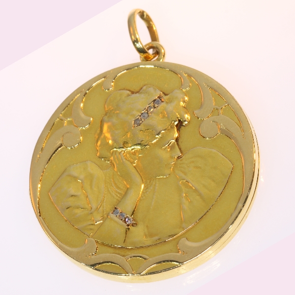 Late Victorian early Art Nouveau locket pendant, womans head with diamonds